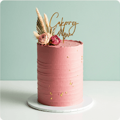 Pink celebration cake with decorative frosting